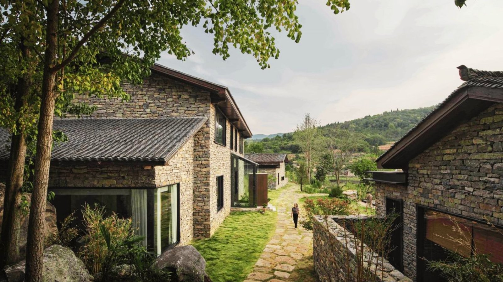 Image shows well planned stone house.
