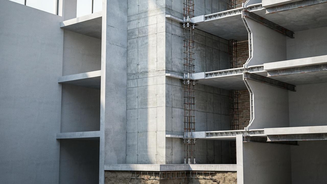 Reinforced concrete load-bearing wall supporting multiple floors with embedded steel reinforcement.