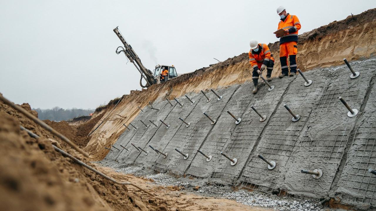 Soil nails reinforce excavation faces and stabilize surrounding ground during construction