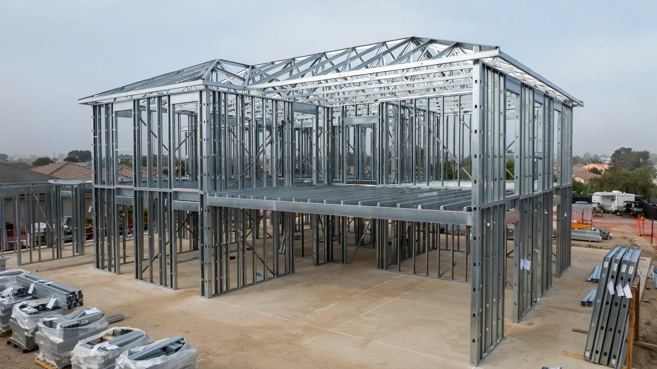 Efficient light gauge steel framing with prefabricated panels being assembled on a residential construction site.