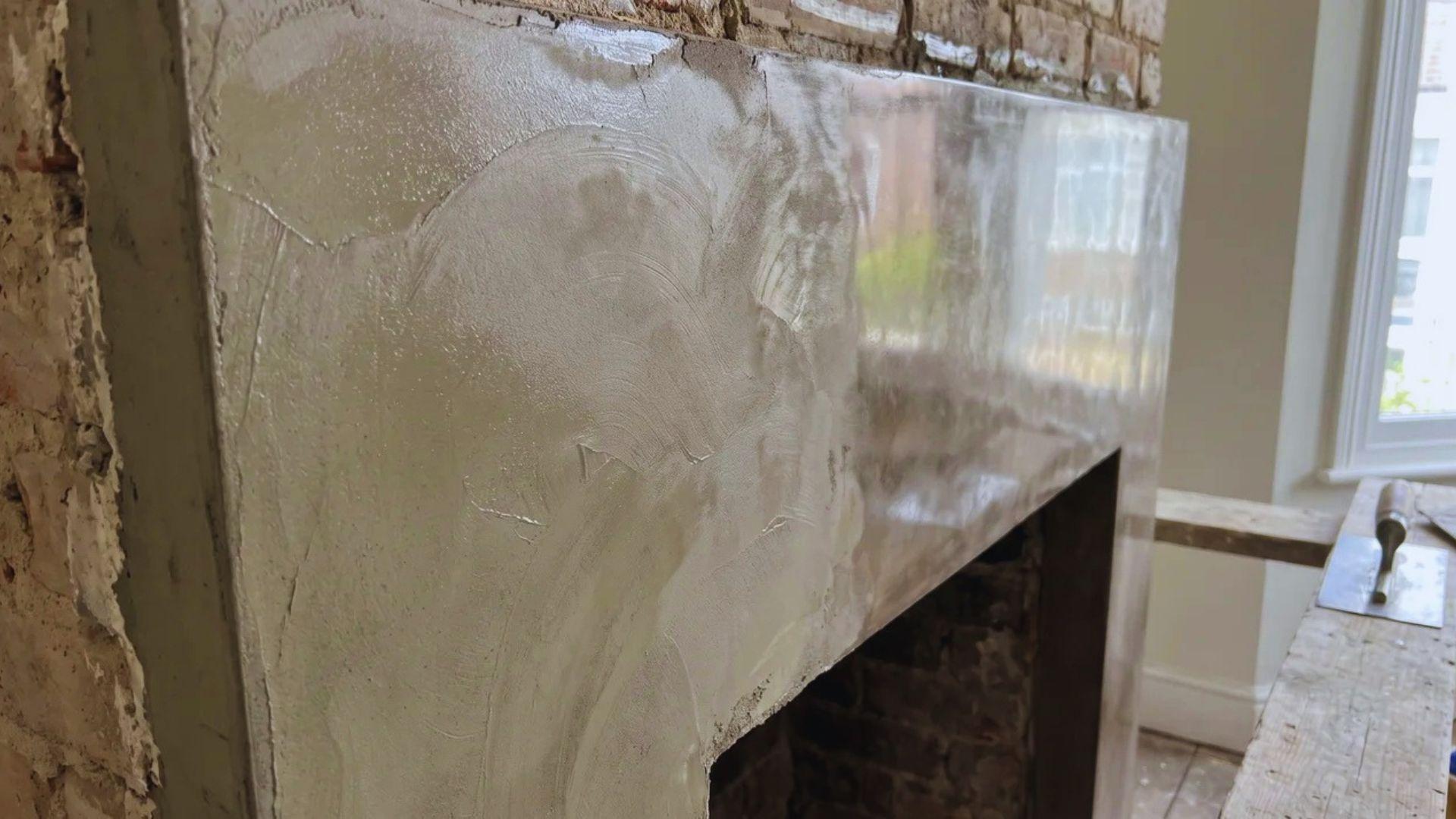 Thin Venetian plaster layer with visible trowel strokes and a smooth burnished surface.