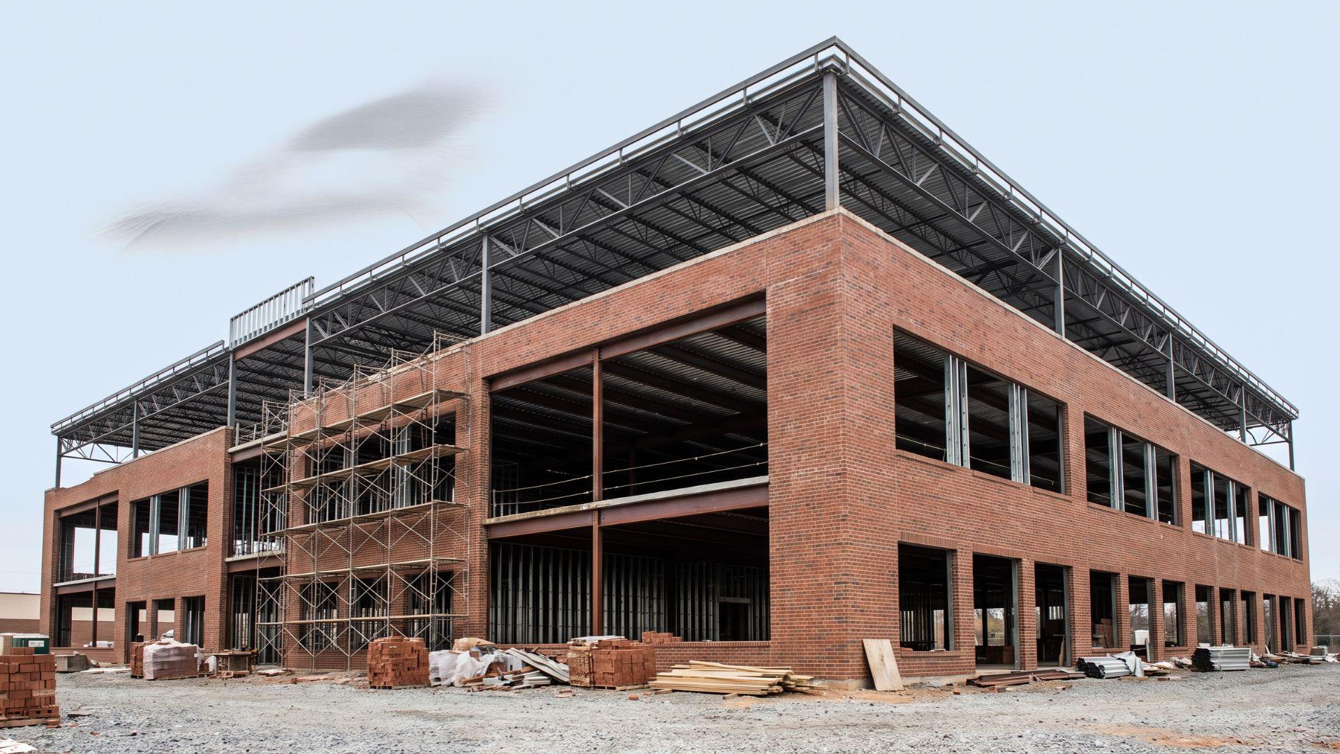 Commercial building with exposed masonry walls and structural floor and roof assemblies.