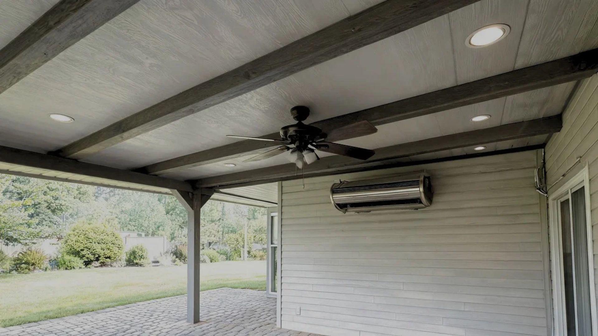 Covered patio with recessed lights, a ceiling fan, and an outdoor heater.