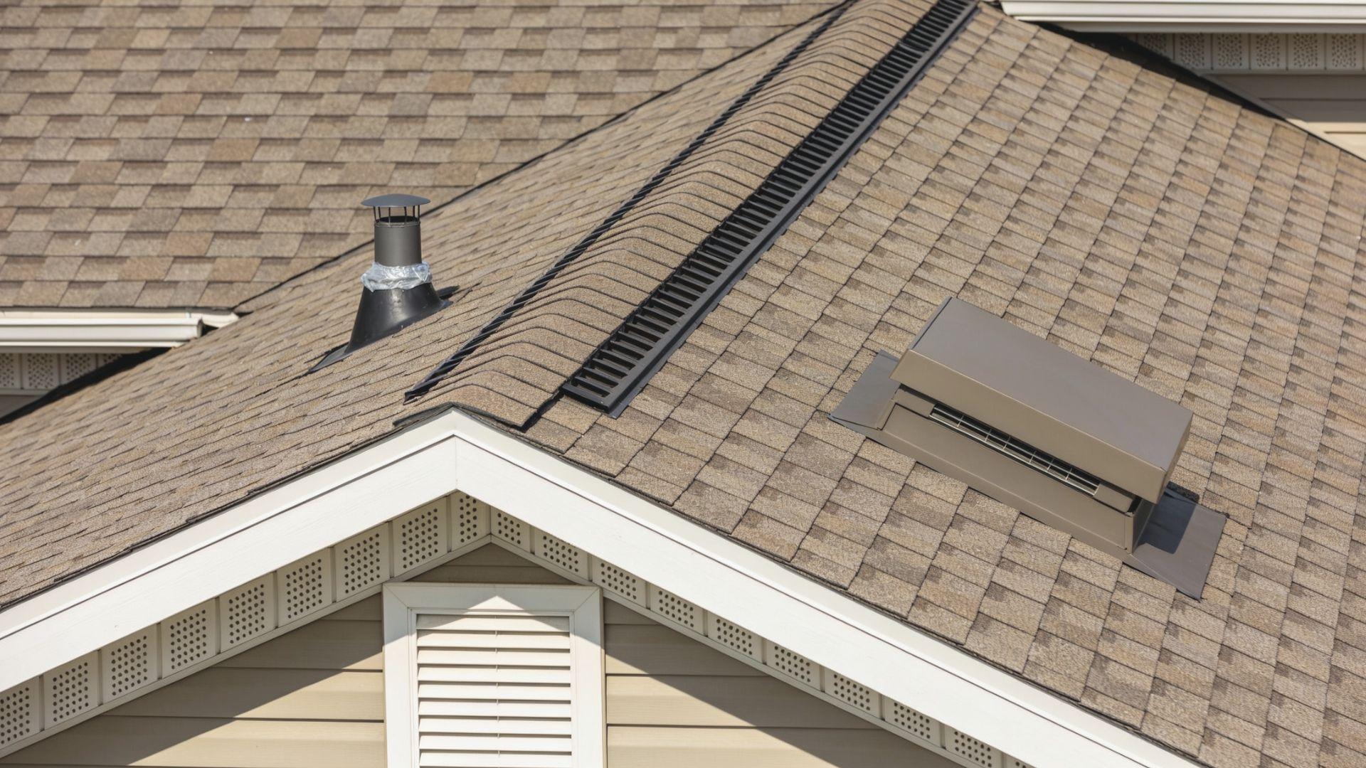 Residential roof featuring a ridge vent, soffit intake vents, box vent, and sealed plumbing pipe FileName-roof-vents-and-ventilation-components