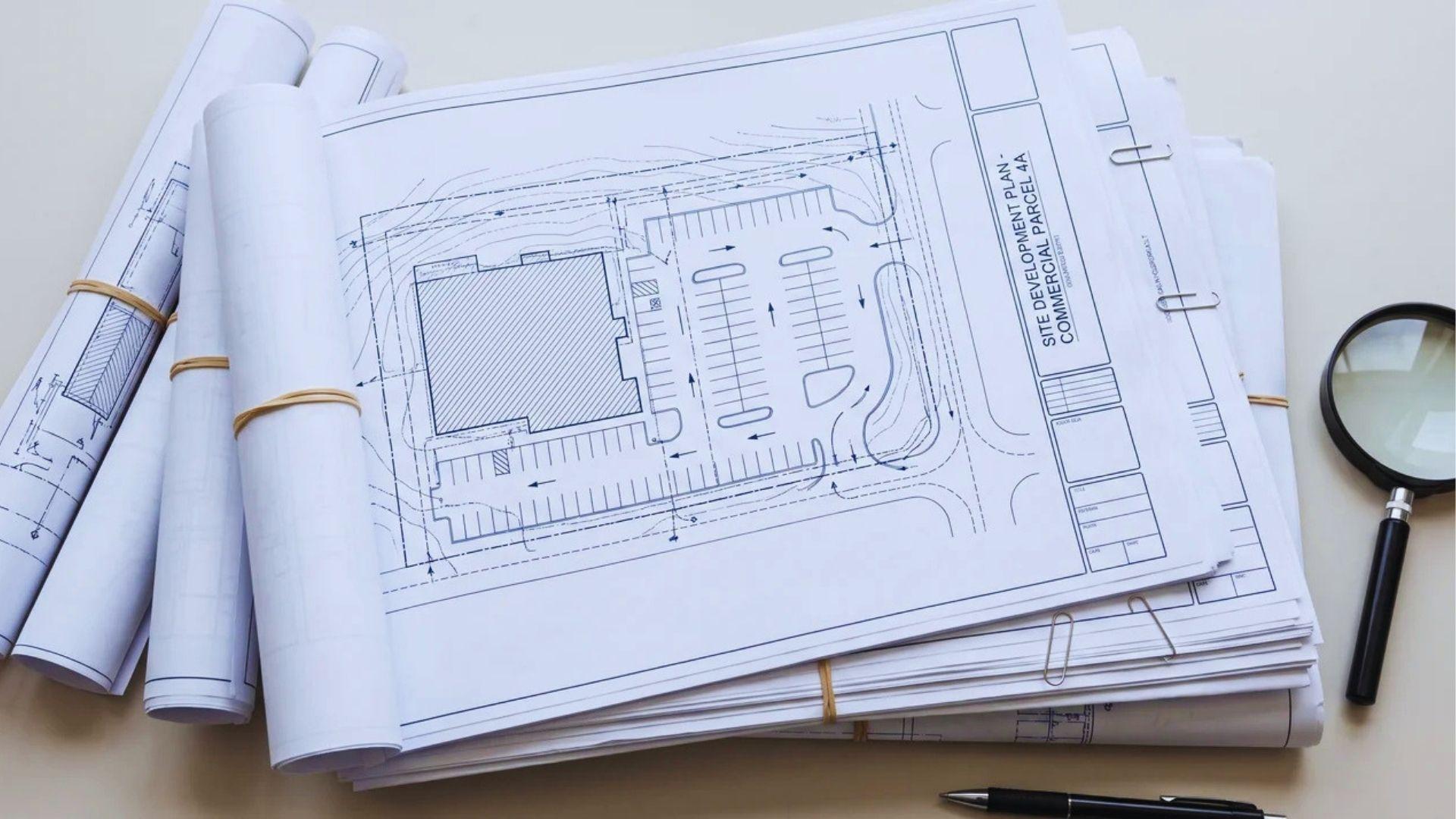 Site development plan package showing a commercial layout, grading contours, drainage, utilities, and parking access.File name-municipal-site-plan-review