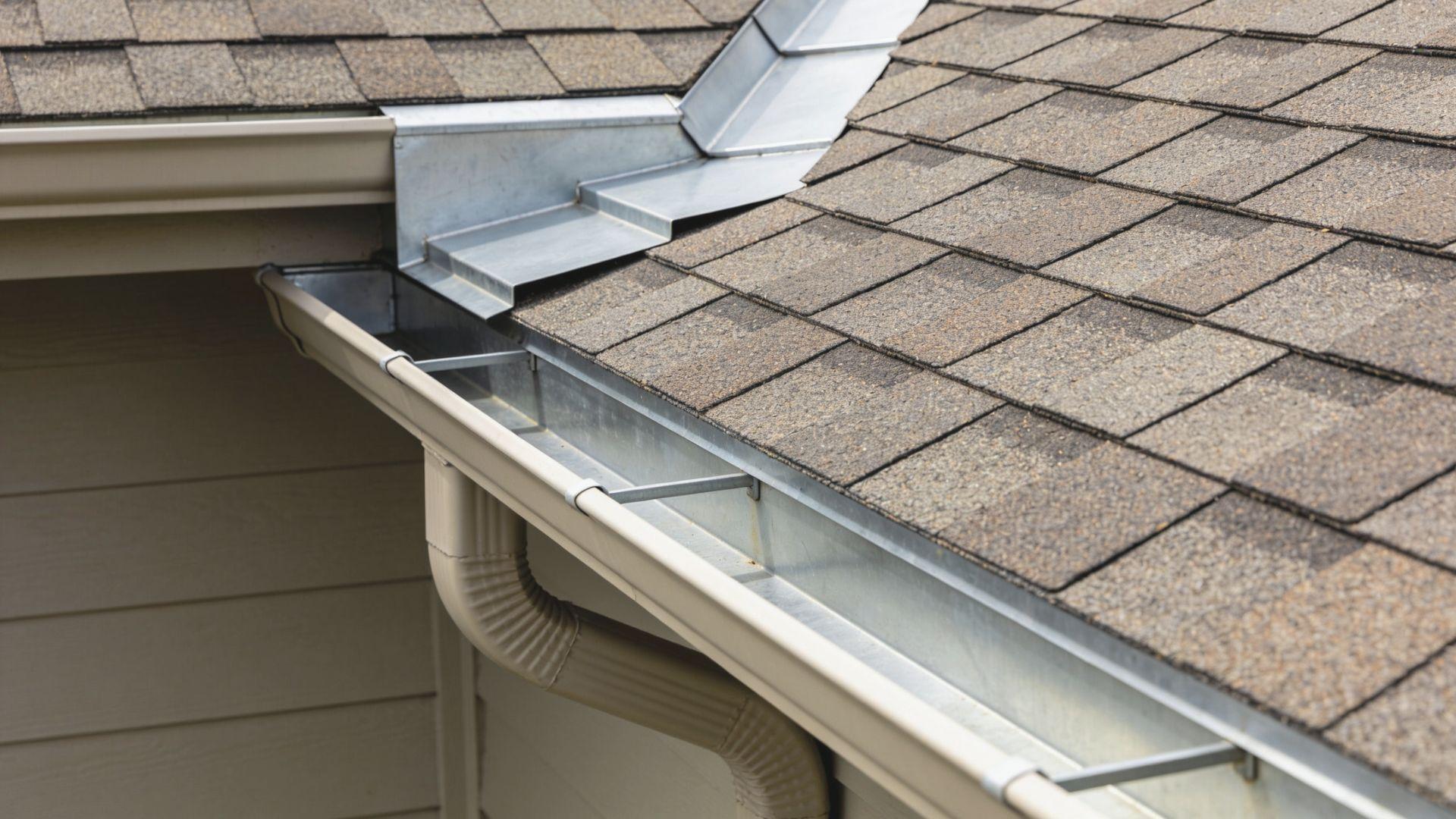 Metal drip edge and overlapping step flashing protect roof edges and wall intersections from water FileName-roof-drip-edges-and-flashing