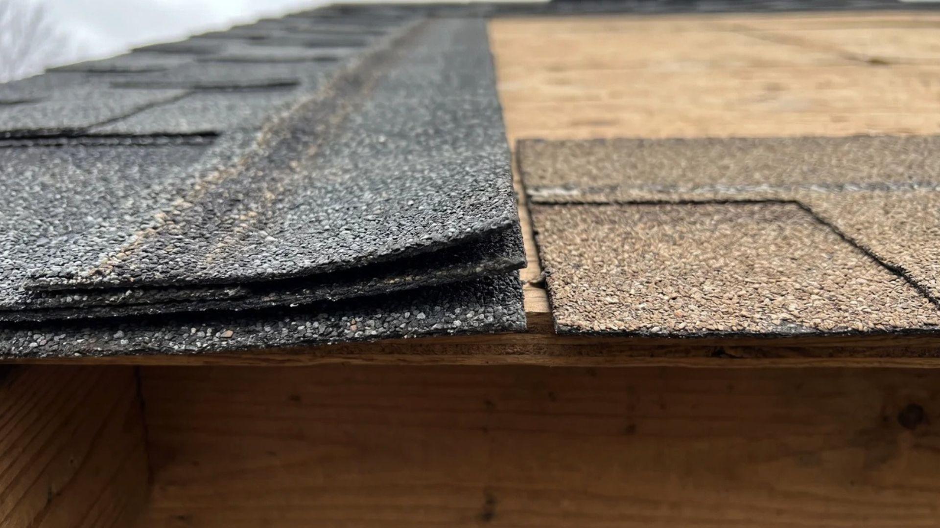 Architectural shingle showing bonded layers and raised edge beside a single-layer 3-tab shingle.
