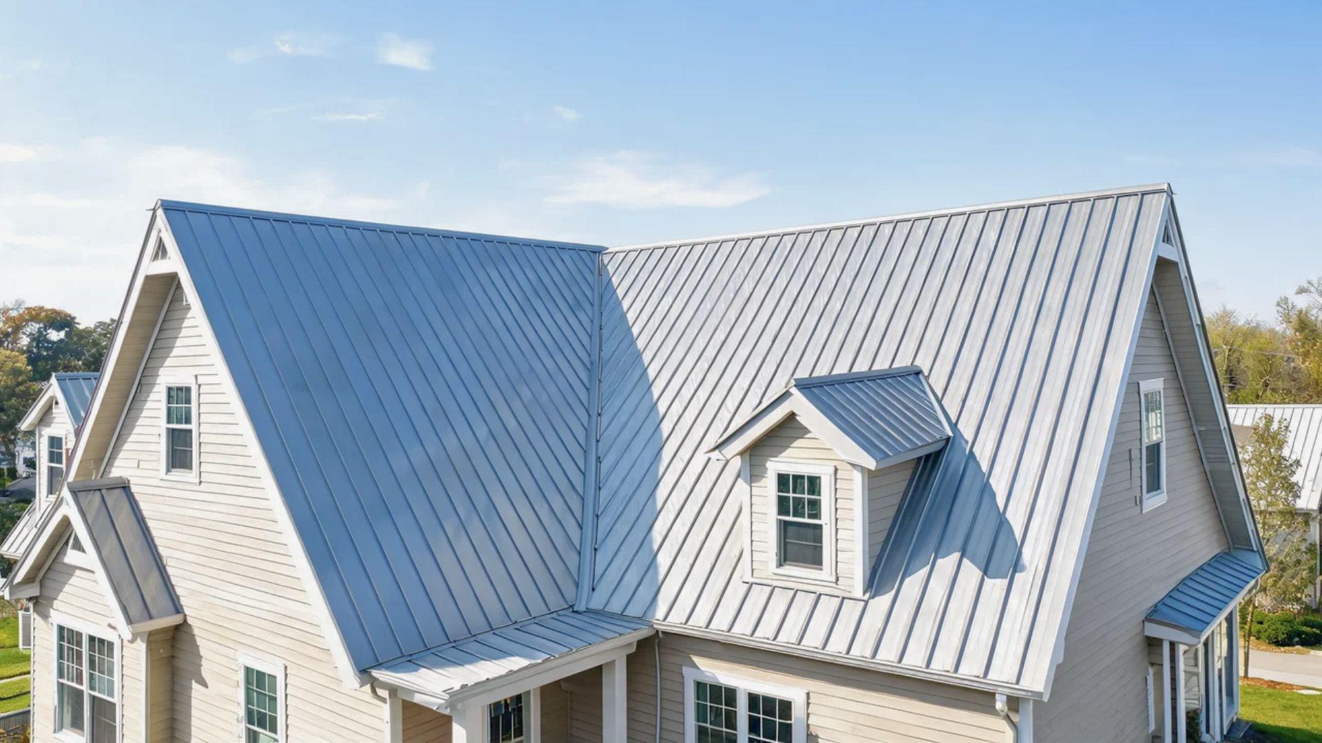 Standing seam metal roof with multiple slopes, valleys, and dormers.